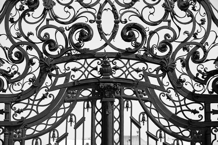 close-up-of-ornaments-on-old-iron-gate